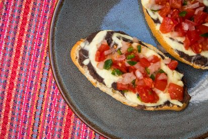 Mollettes topped with pico de gallo salsa.